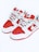 A pair of stylish sneakers with a bold red and white color scheme. The sneakers feature a prominent logo on the tongue and side, and are equipped with white laces.