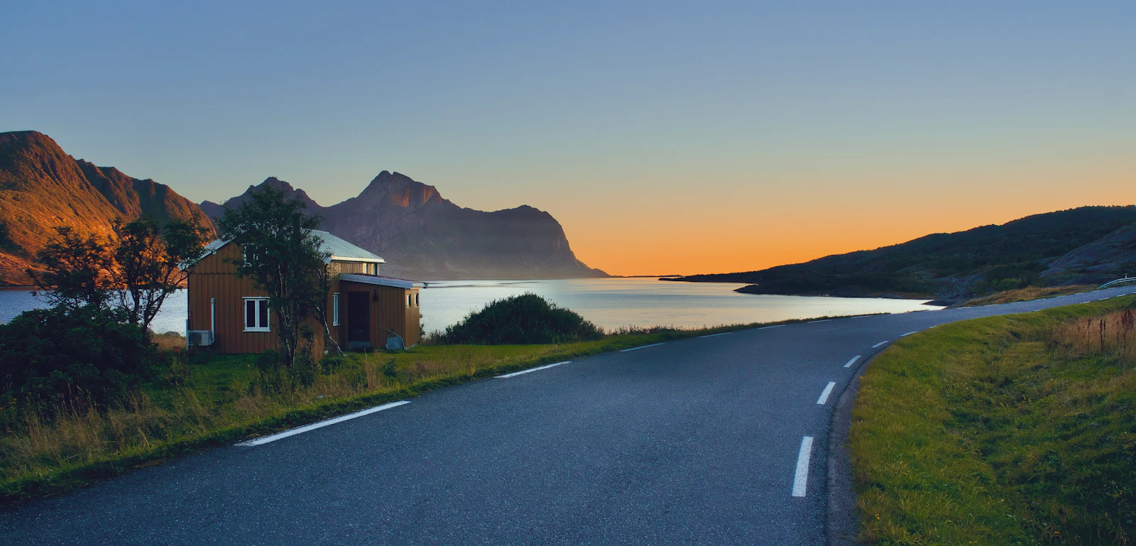 A road running beside water on Norway's Atlantic coast
