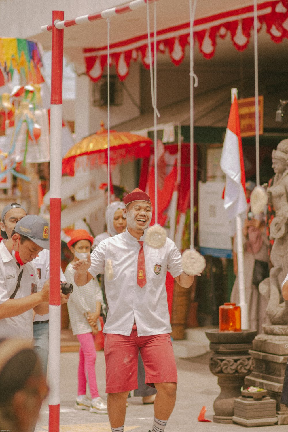 a person in a garment holding a flag