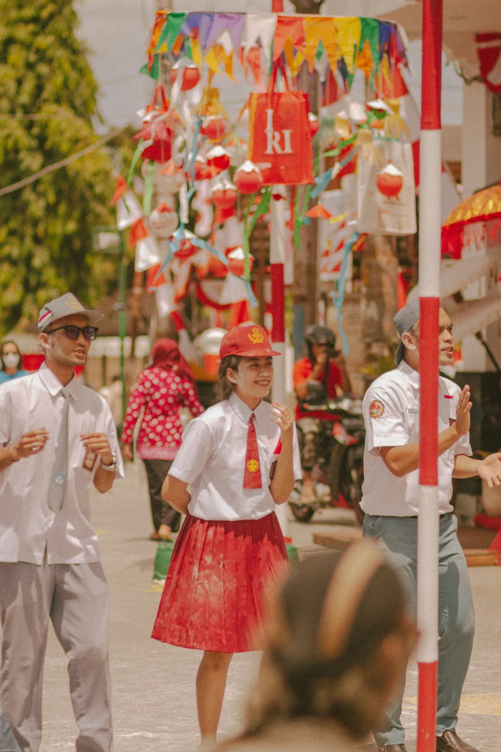 a group of people walking down a street