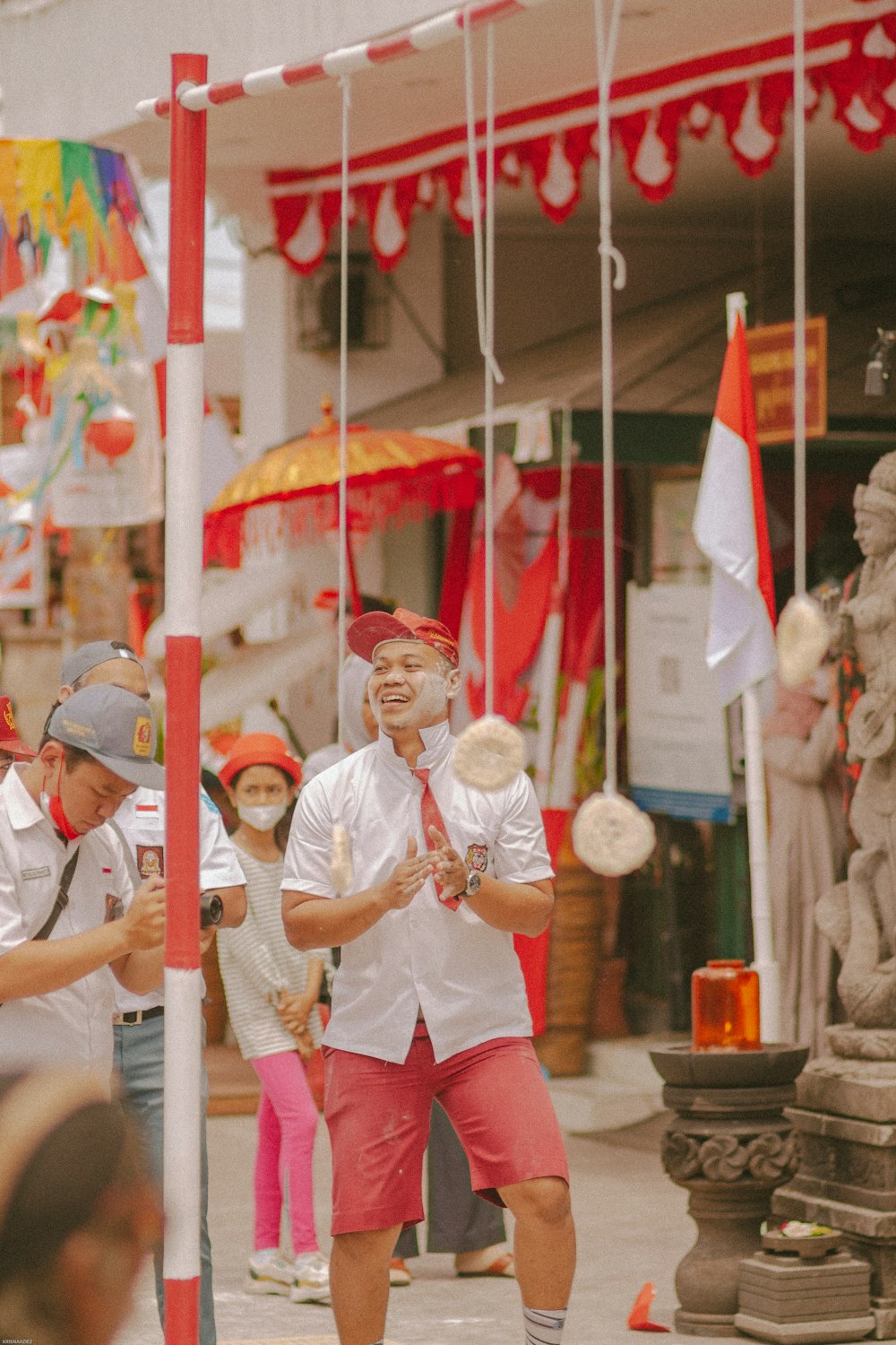 a person in a garment holding a flag