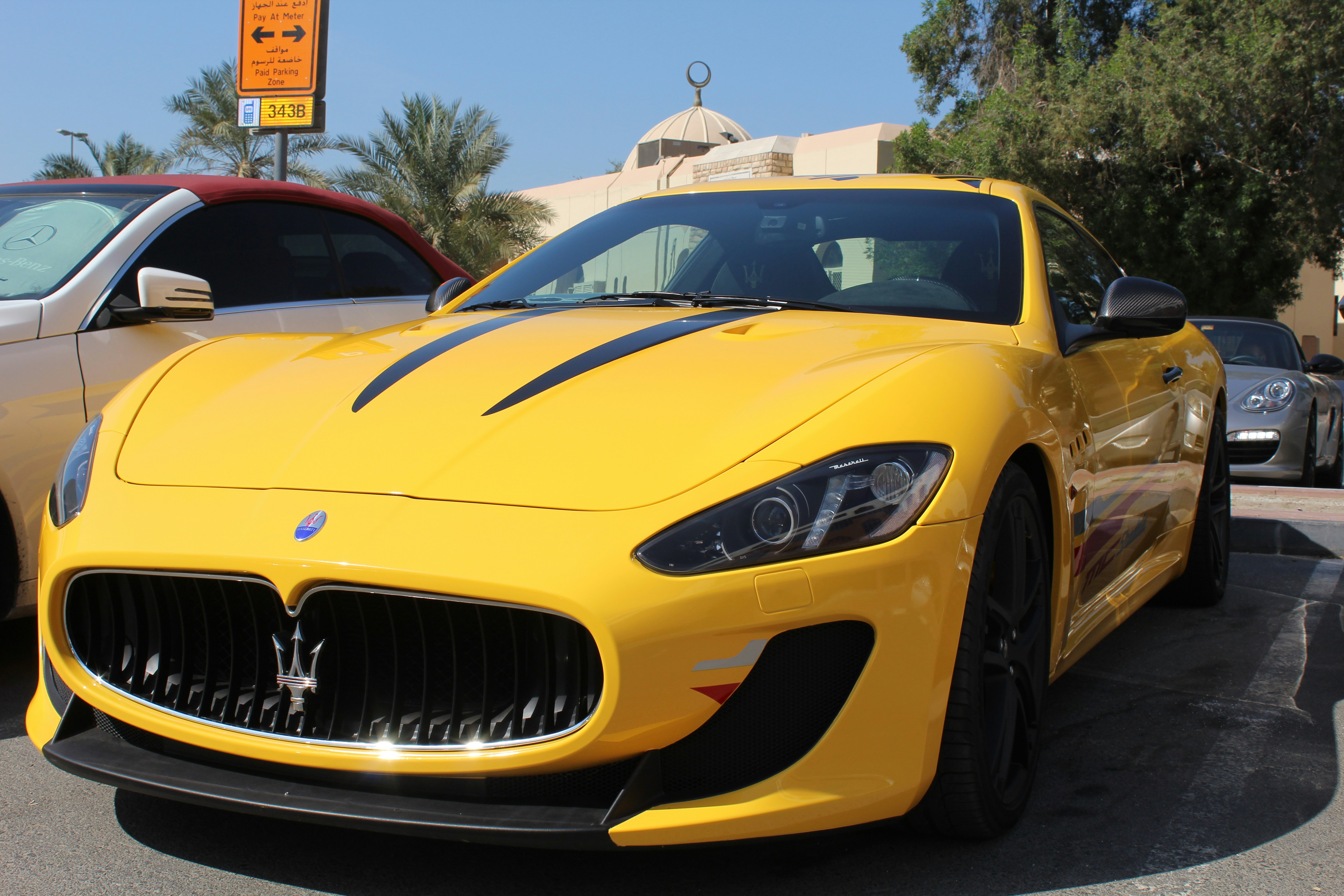 a yellow car parked on the street