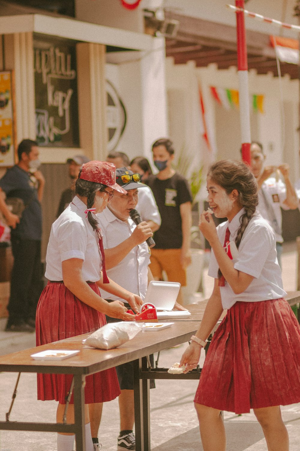 a woman talking to a man at a table