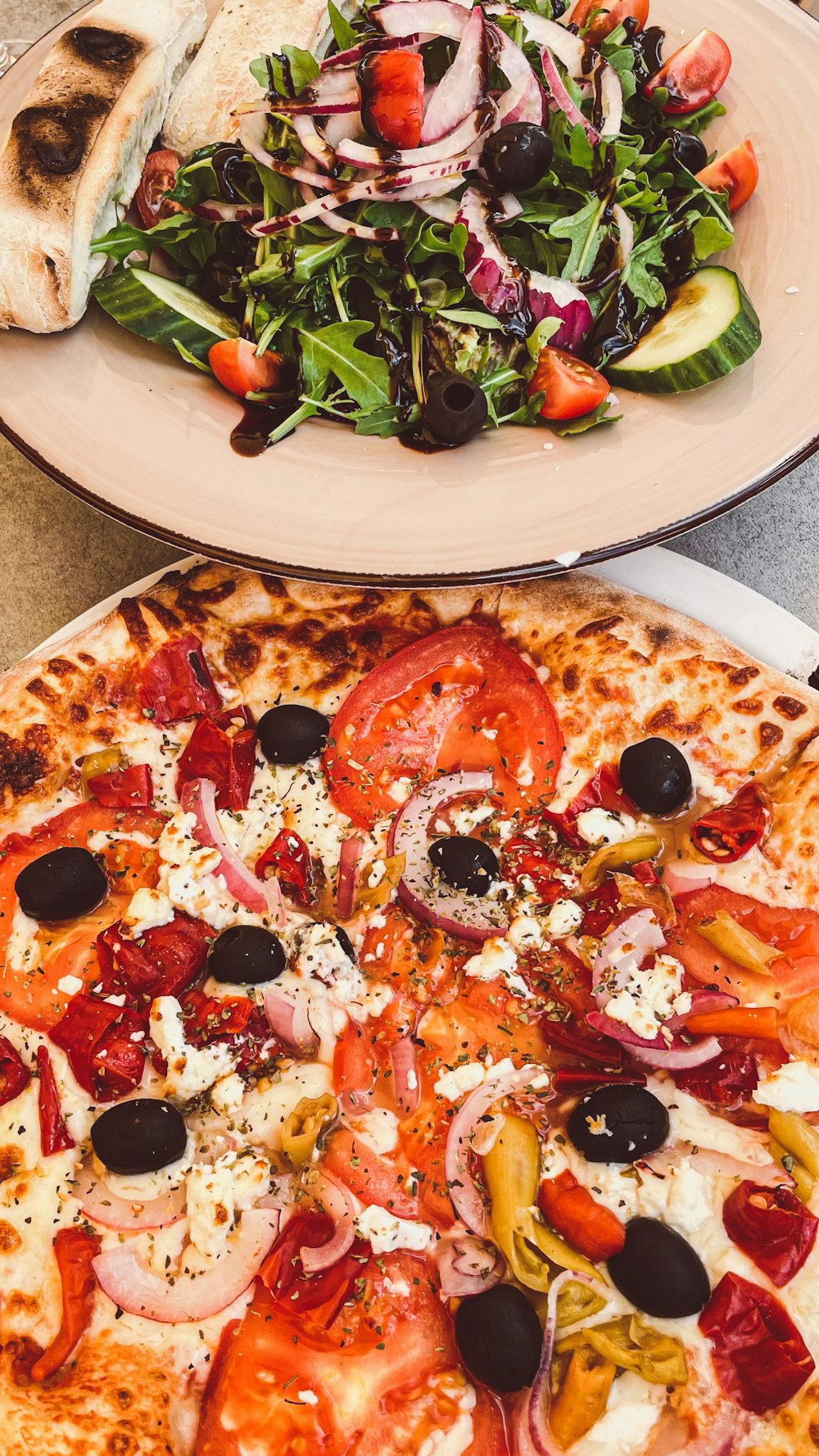 a plate of pizza and salad