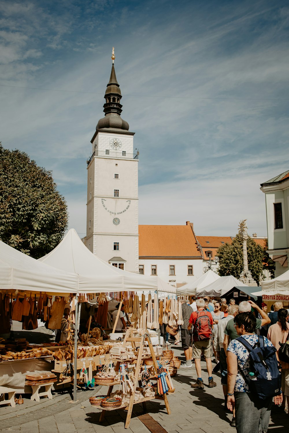 a group of people at an outdoor market