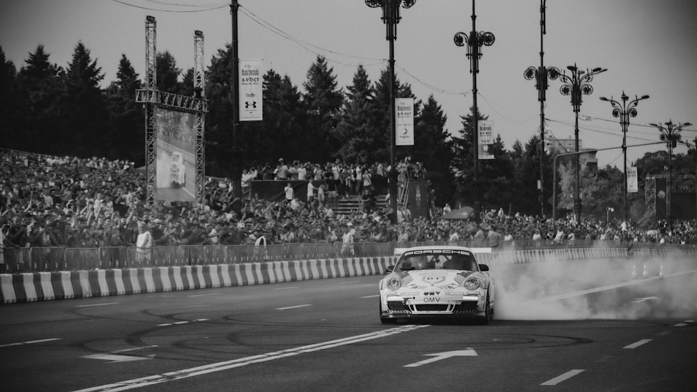 a car on a road with smoke coming out of it