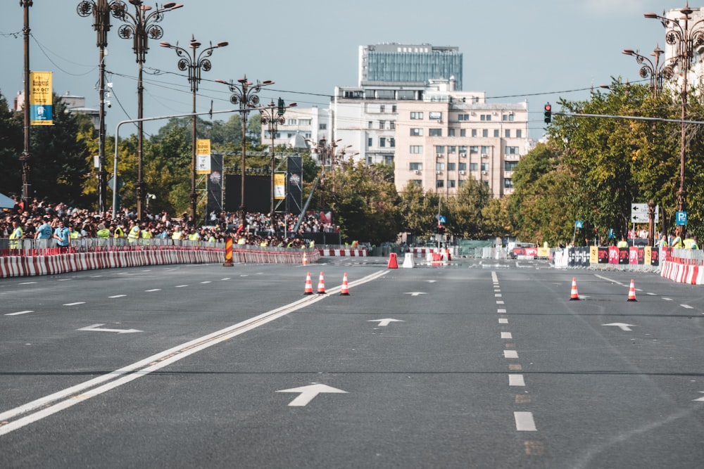 a road with a crowd of people on the side