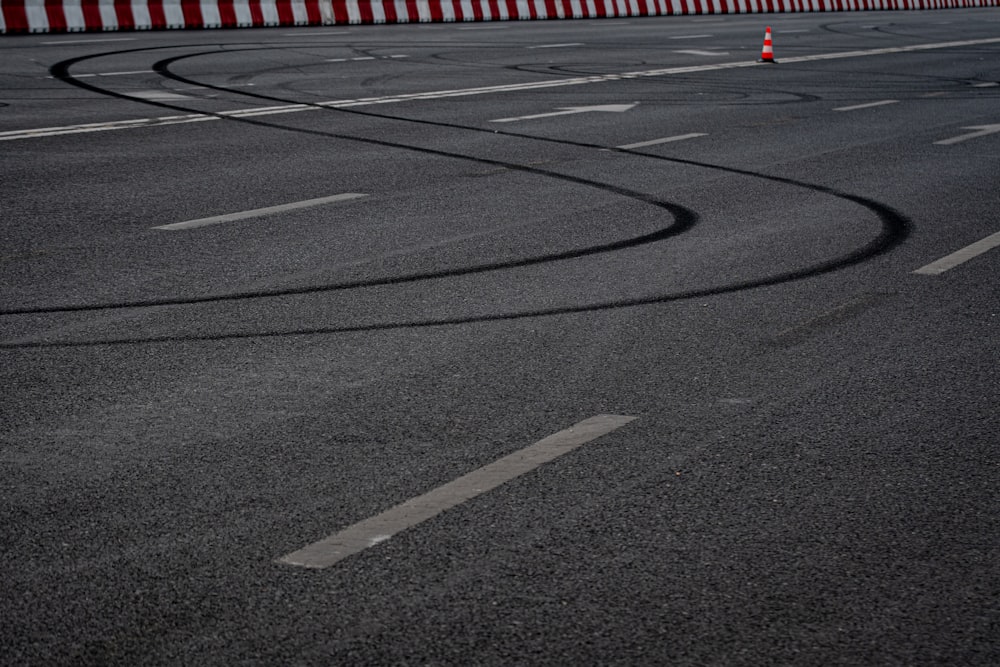 a road with a cone on the side