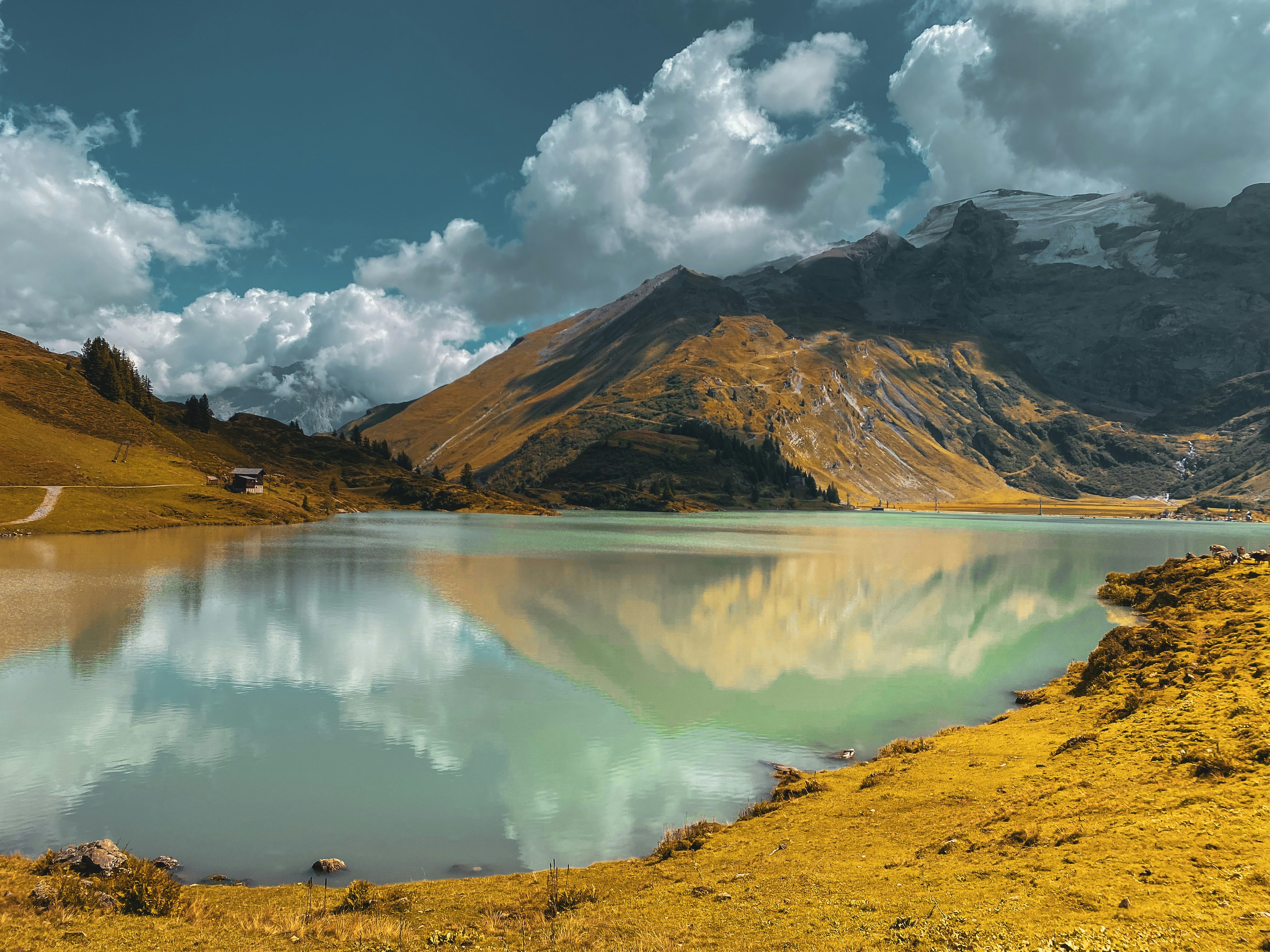 a lake in front of a mountain