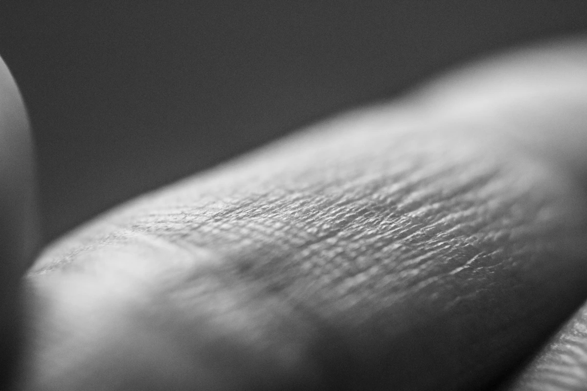 Close-up of finger skin texture, representing nail and skin condition diagnosis