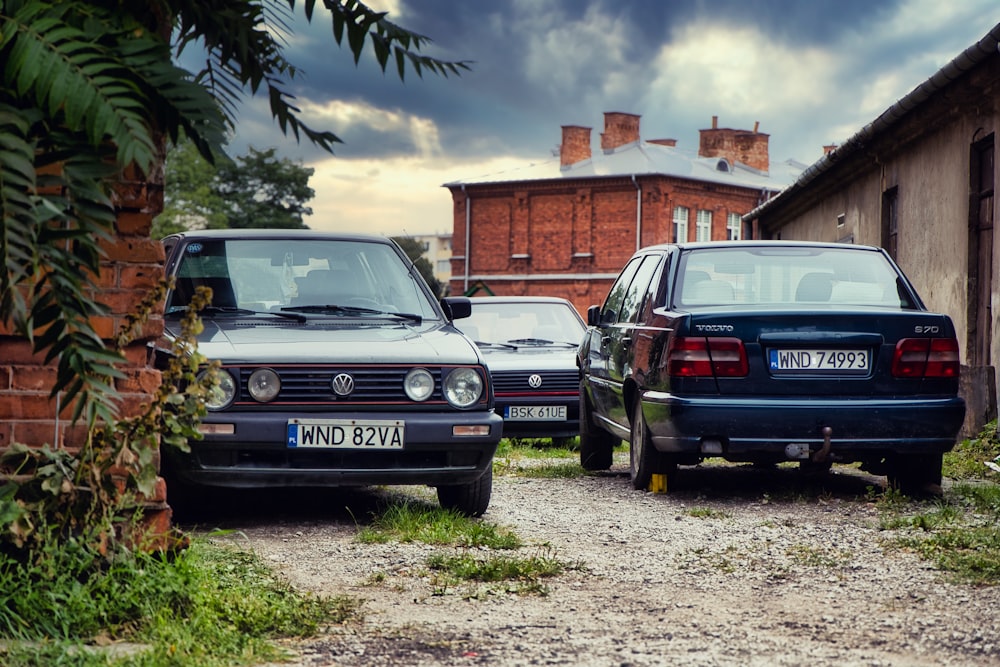 a row of cars parked in a driveway