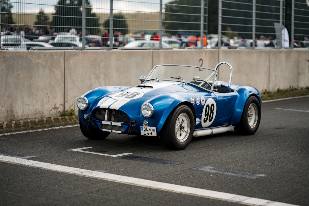 a blue car on a road