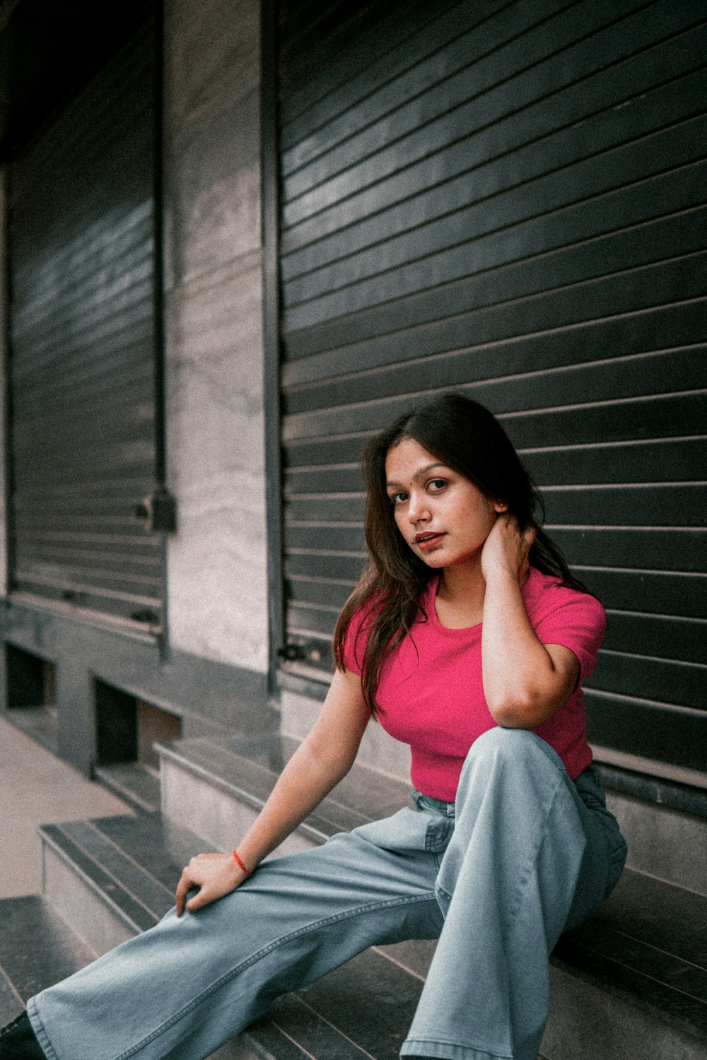 a woman sitting on a staircase