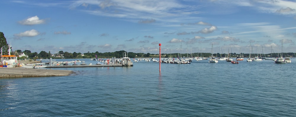 a body of water with boats in it and buildings in the back