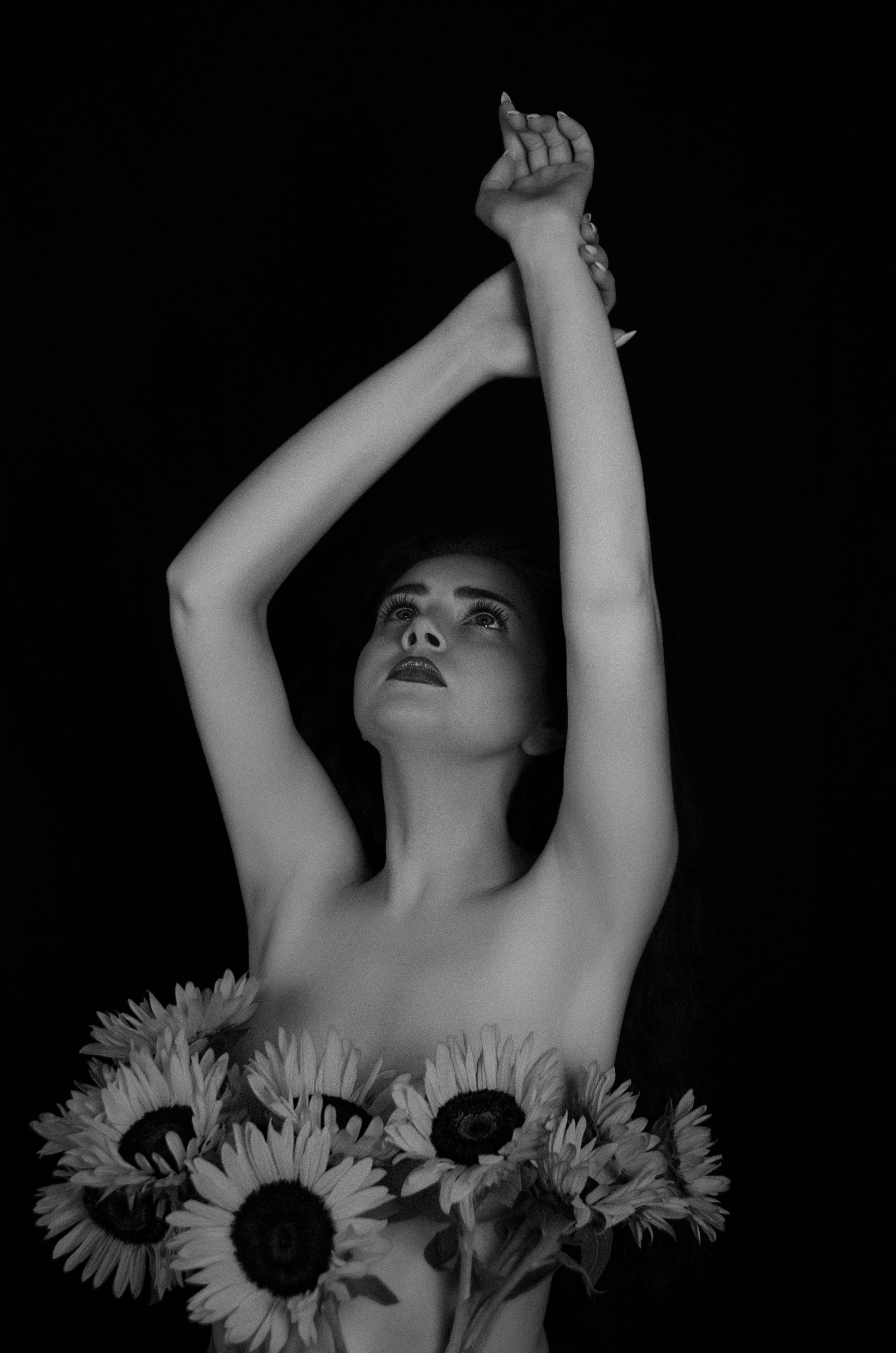 a woman with her arms raised