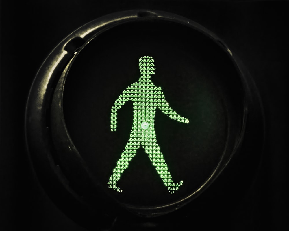 a green figure in a circle