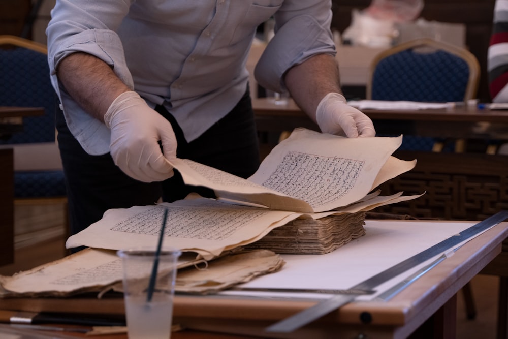 a person writing on a book