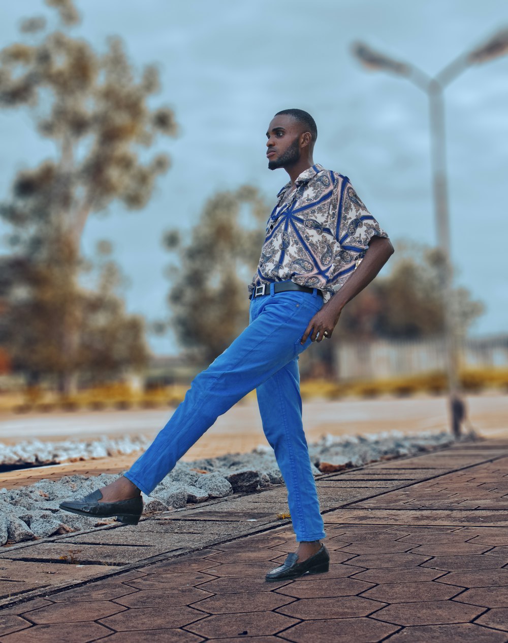 a person standing on a brick path