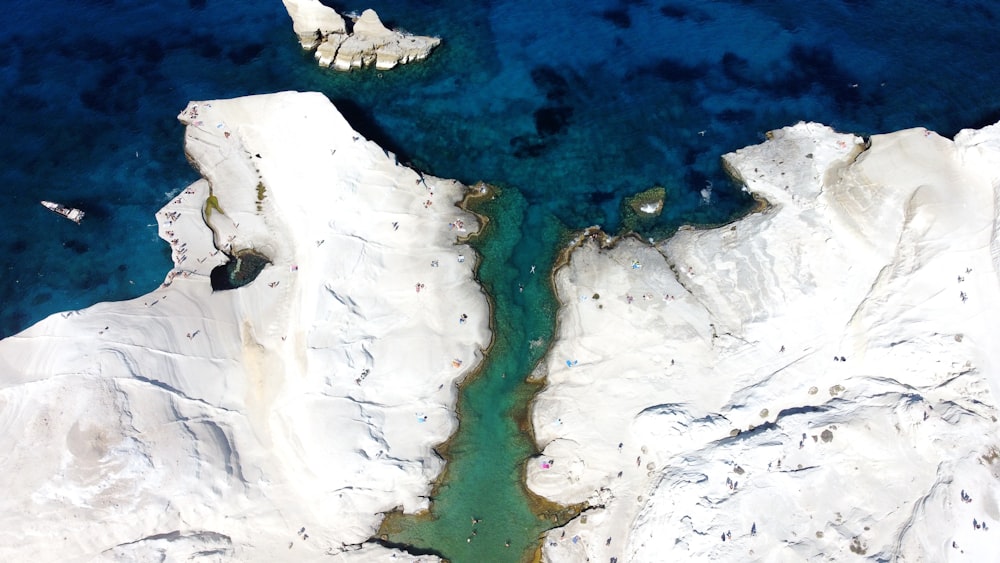 a large body of water with ice and snow on it