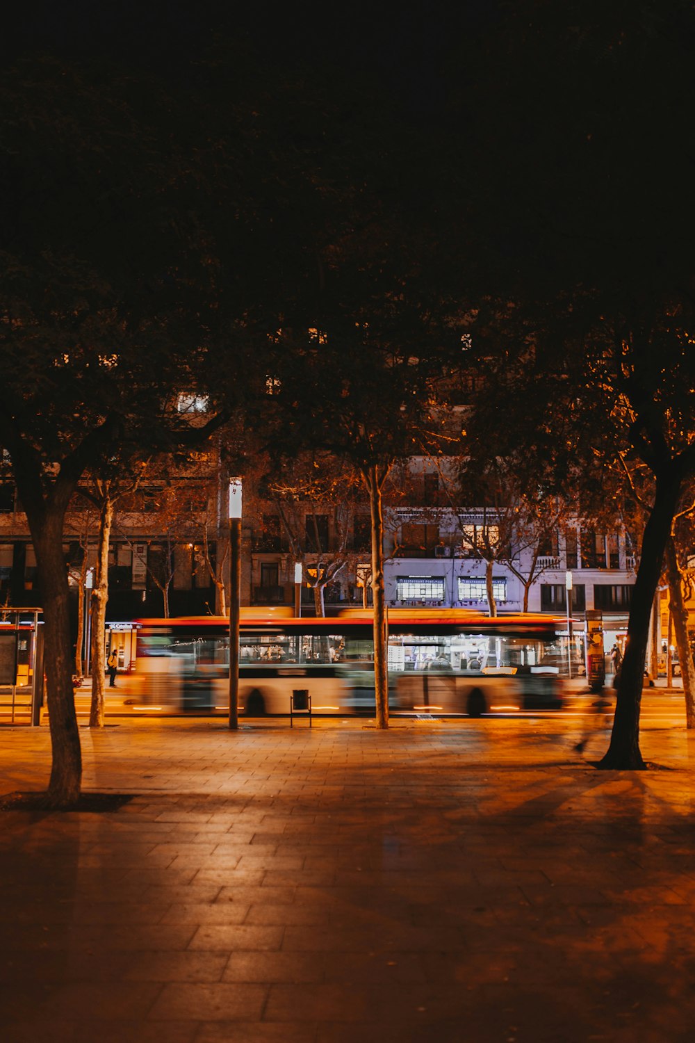 a bus travels down the street