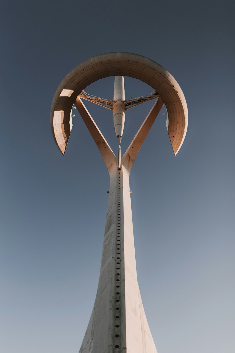 a tall tower with a cross on top