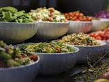 a group of bowls full of food