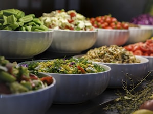 a group of bowls full of food
