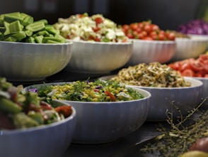 a group of bowls full of food