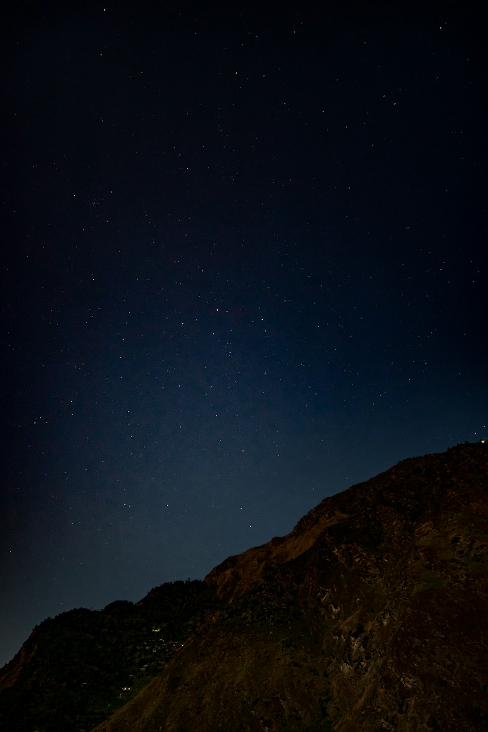 a mountain with a starry sky above it