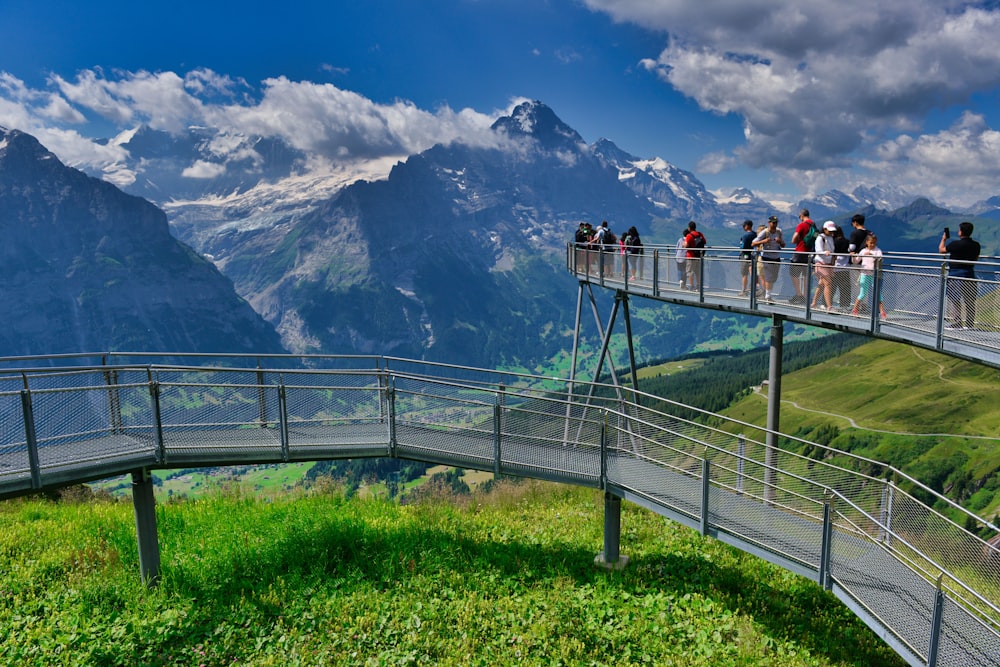 a group of people on a bridge