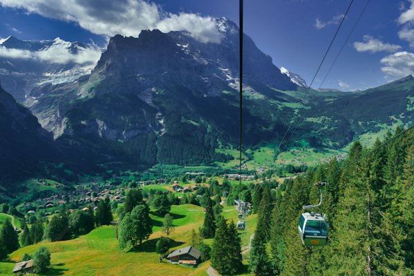 A cable car going up a mountain — Grindelwald, Switzerland