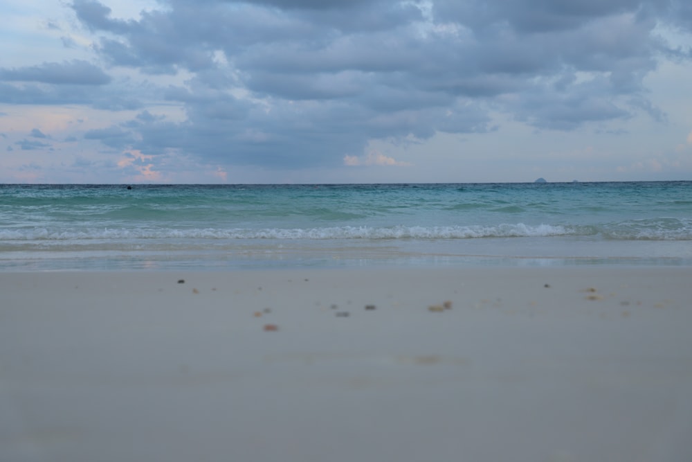 a beach with clear blue water