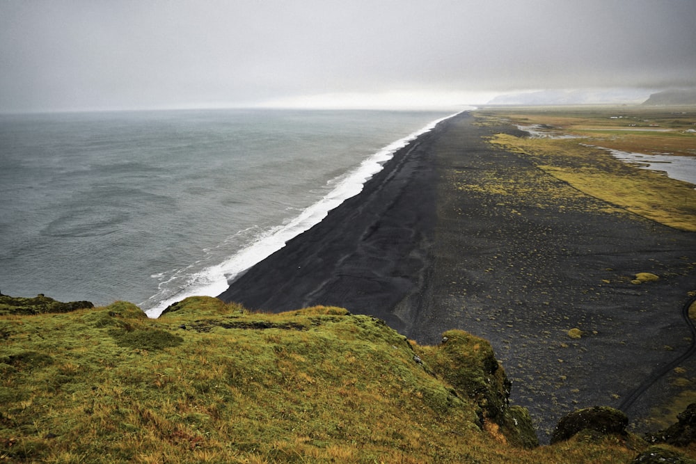 a beach with waves crashing on it