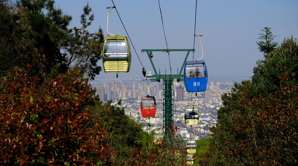 a group of cable cars going over a bridge
