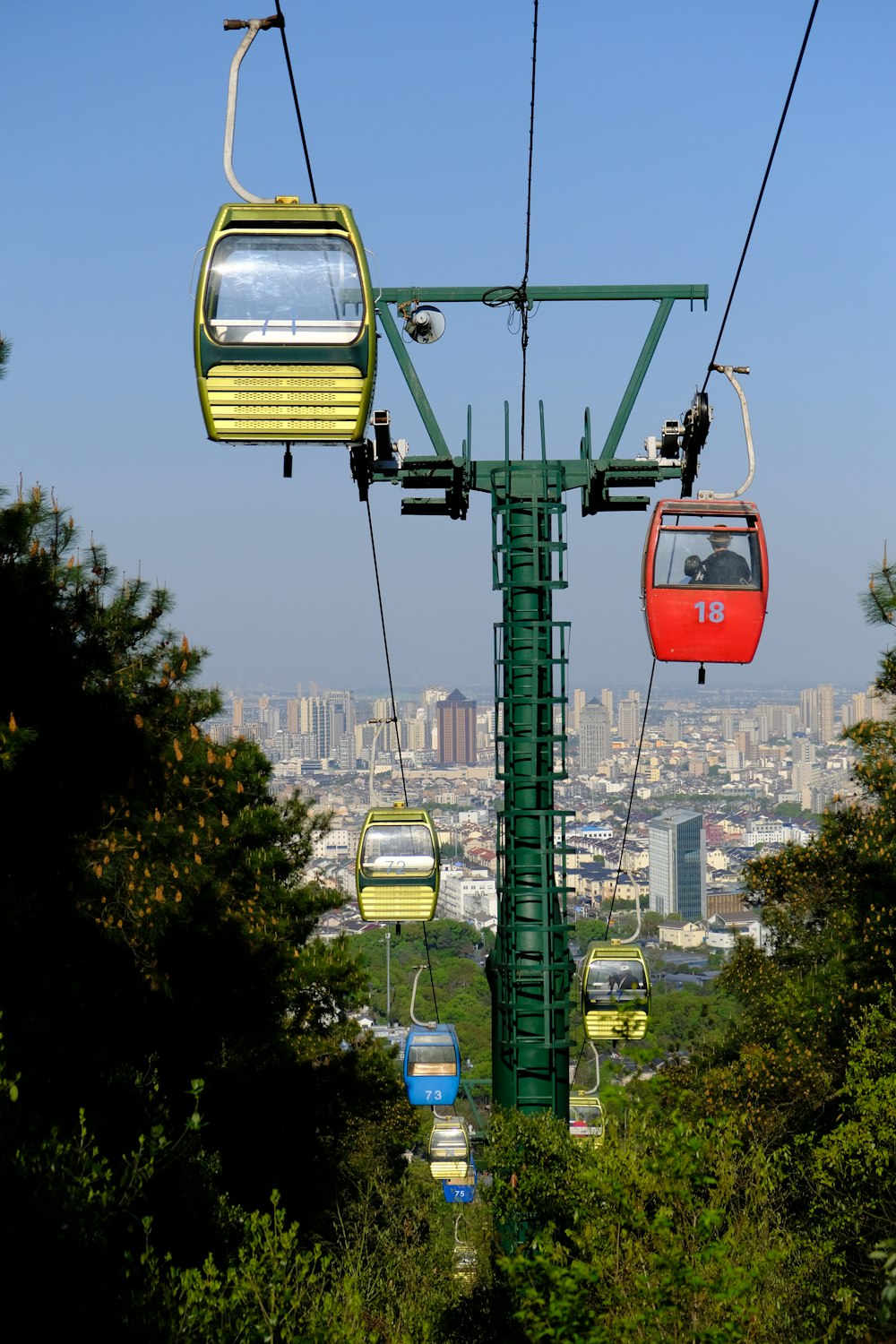 a group of people riding a cable car