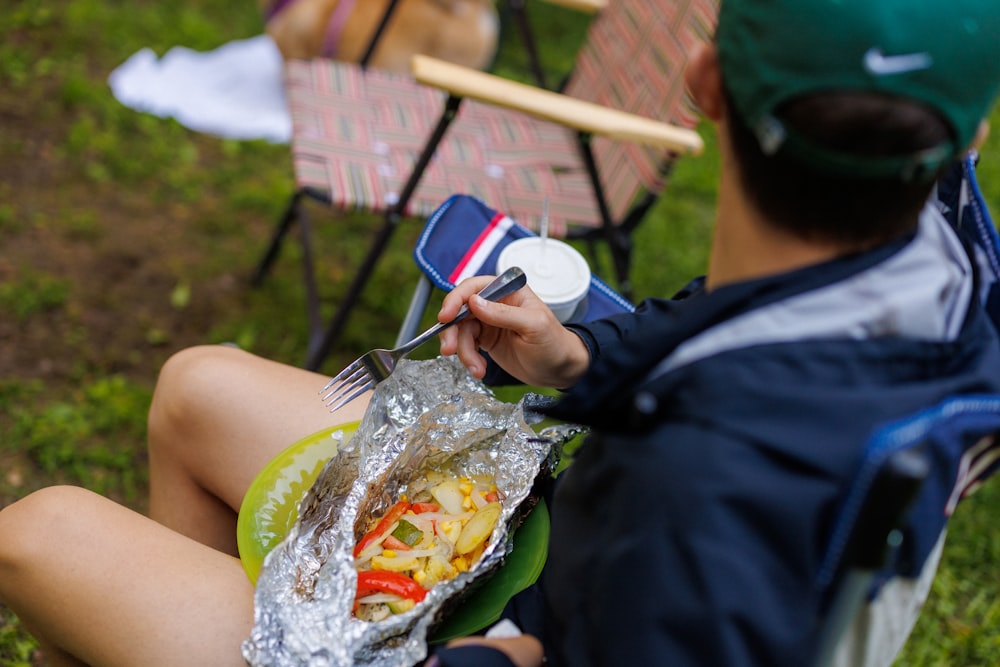 a person eating a hot dog