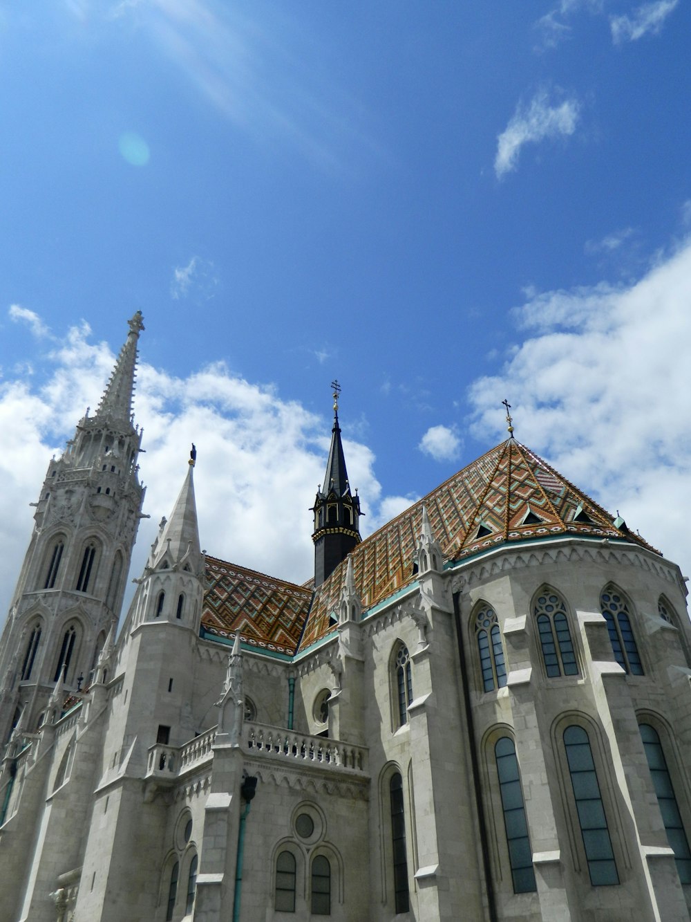 a large building with towers with Matthias Church in the background