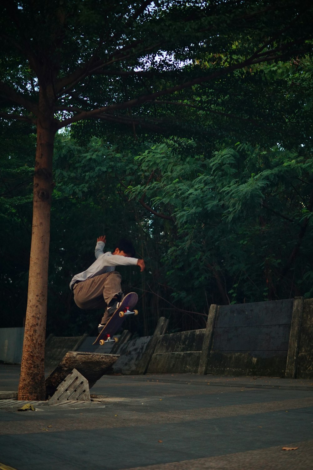 a man jumping in the air on a skateboard