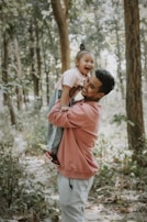 a person carrying a child