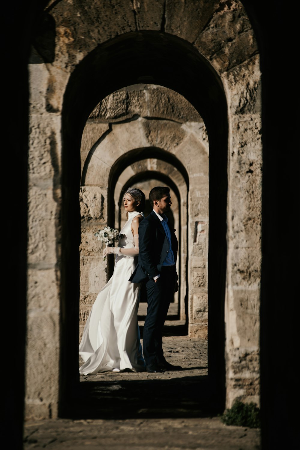 a bride and groom standing in a doorway