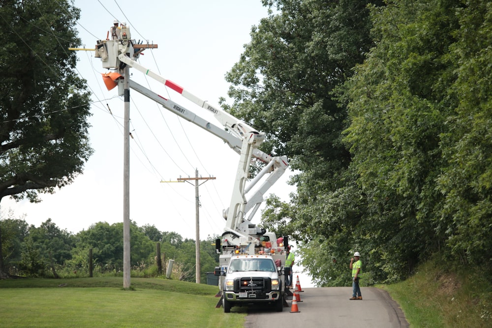 a crane lifting a truck