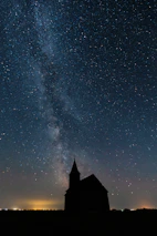 A silhouette of Jesus standing before a starry night, inspired by Micah 5:2.