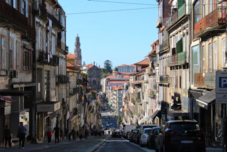 a busy street with cars and people