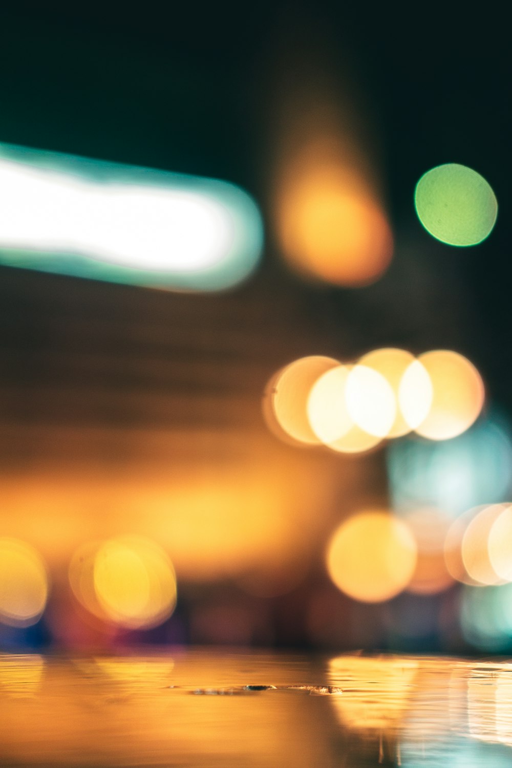 blurry close-up of a city street at night