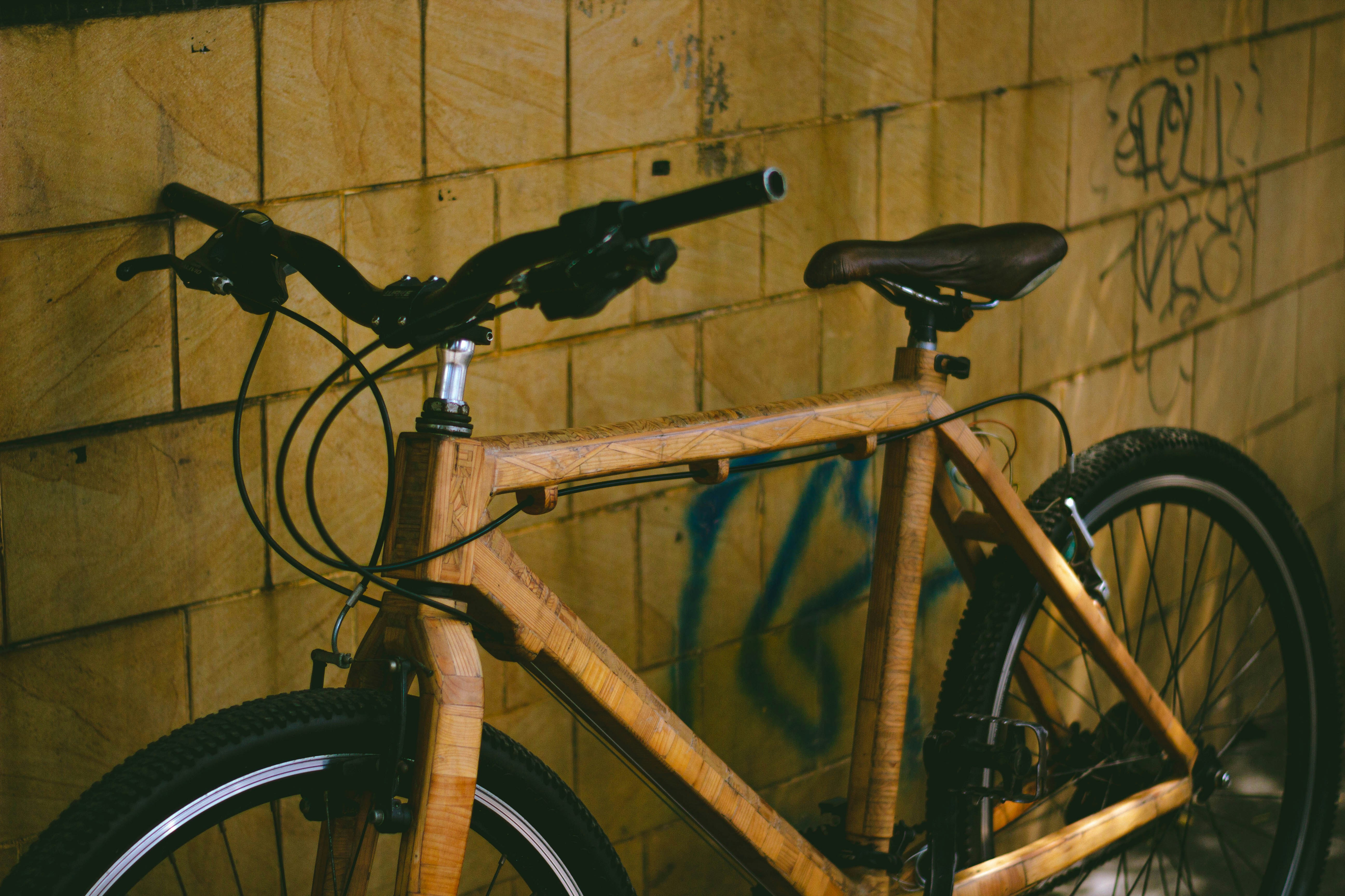 a resident using a Peloton bike in an apartment gym - apartments with fitness center