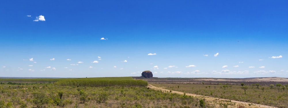 a field with a building in it