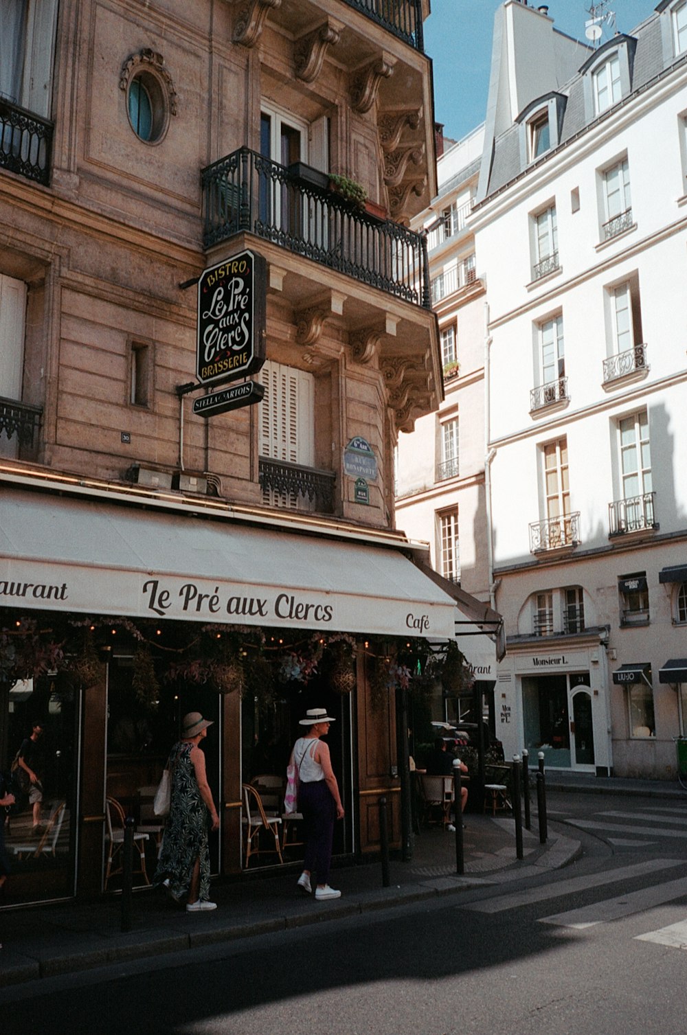 a couple of people stand outside a store