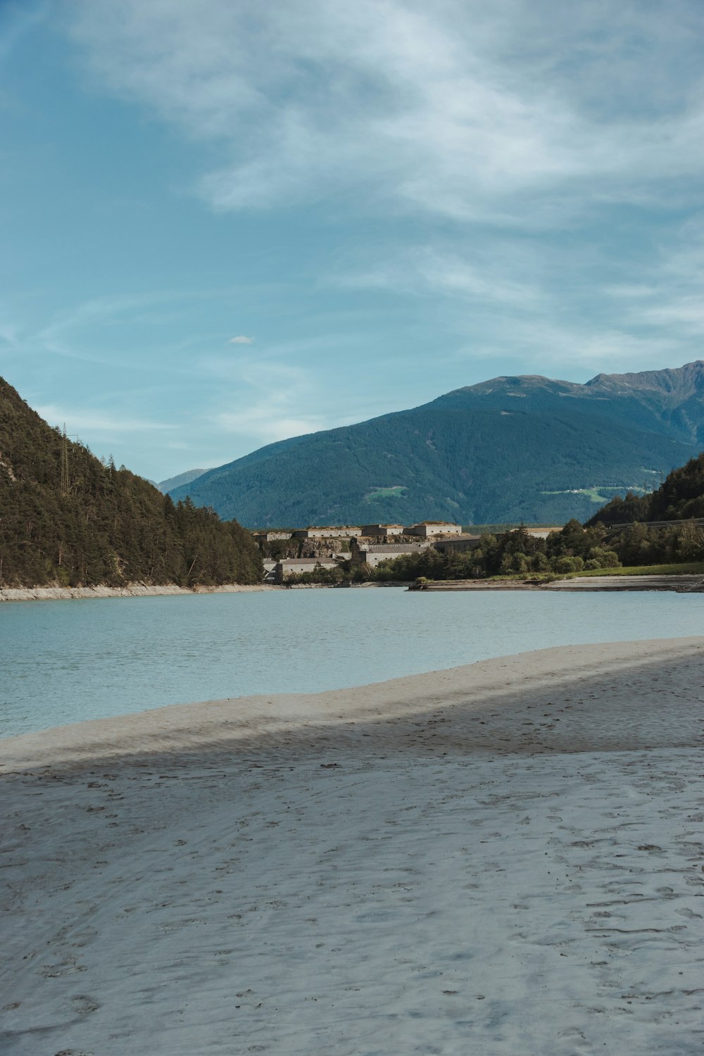 a beach with a town in the distance