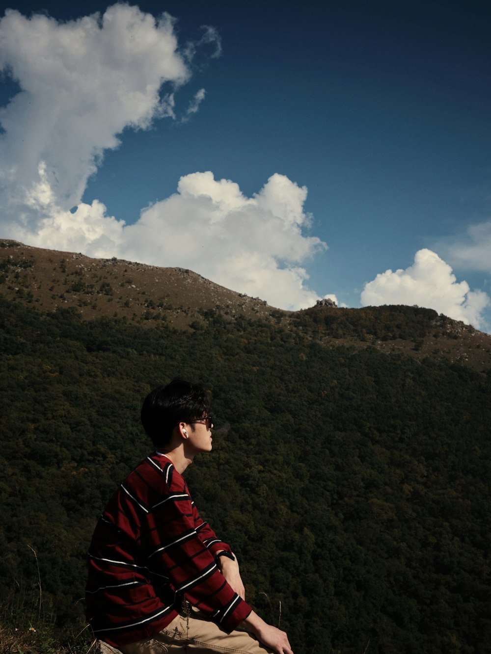 a man sitting on a rock