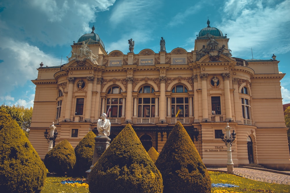 a large building with a statue in front of it